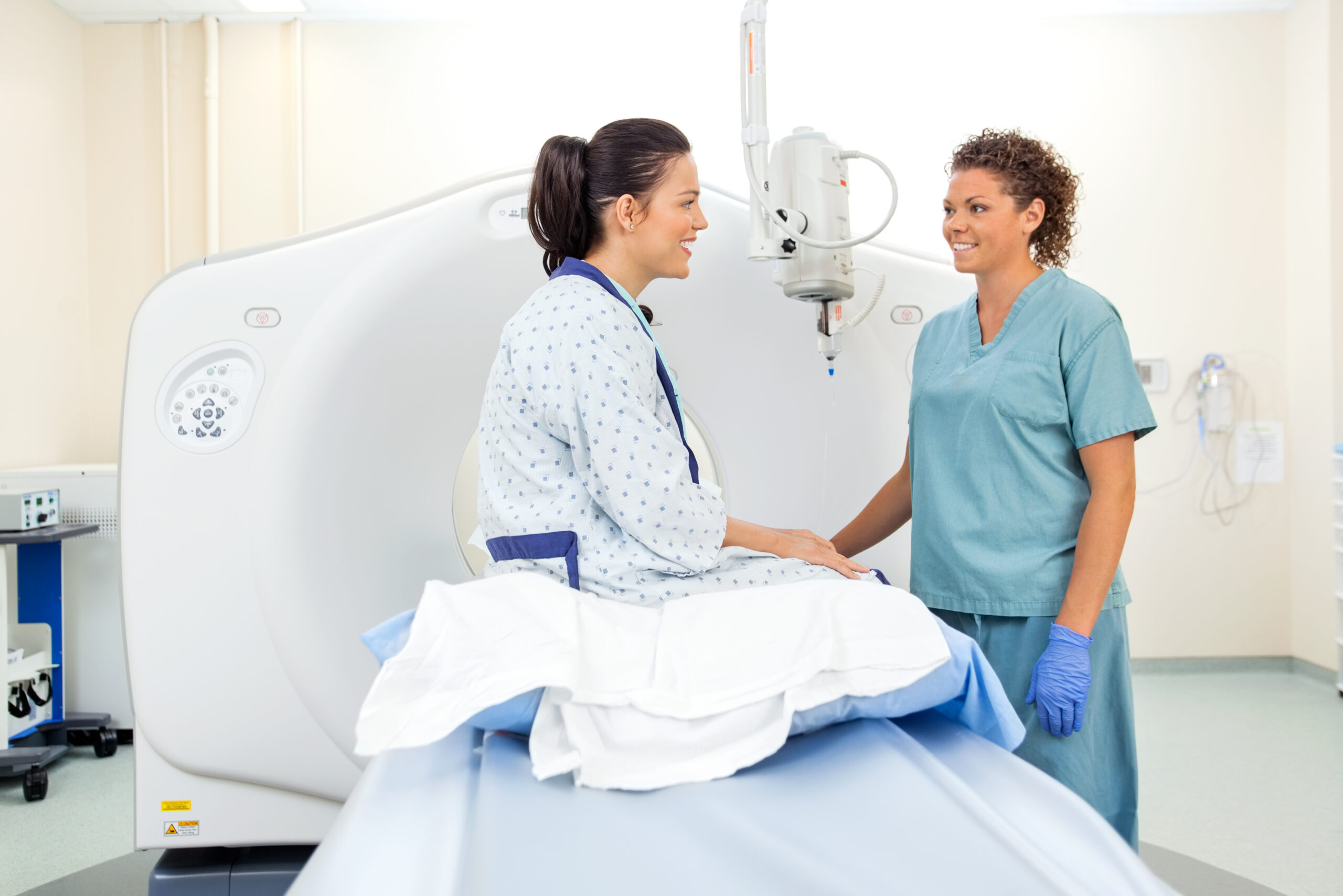 CT Tech And Patient In CT Scan Room